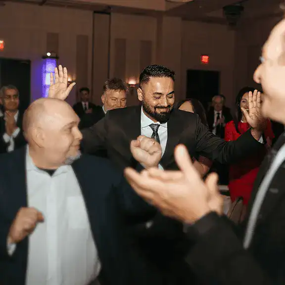 InXpress - Business professionals celebrating at a franchising event for InXpress Global.